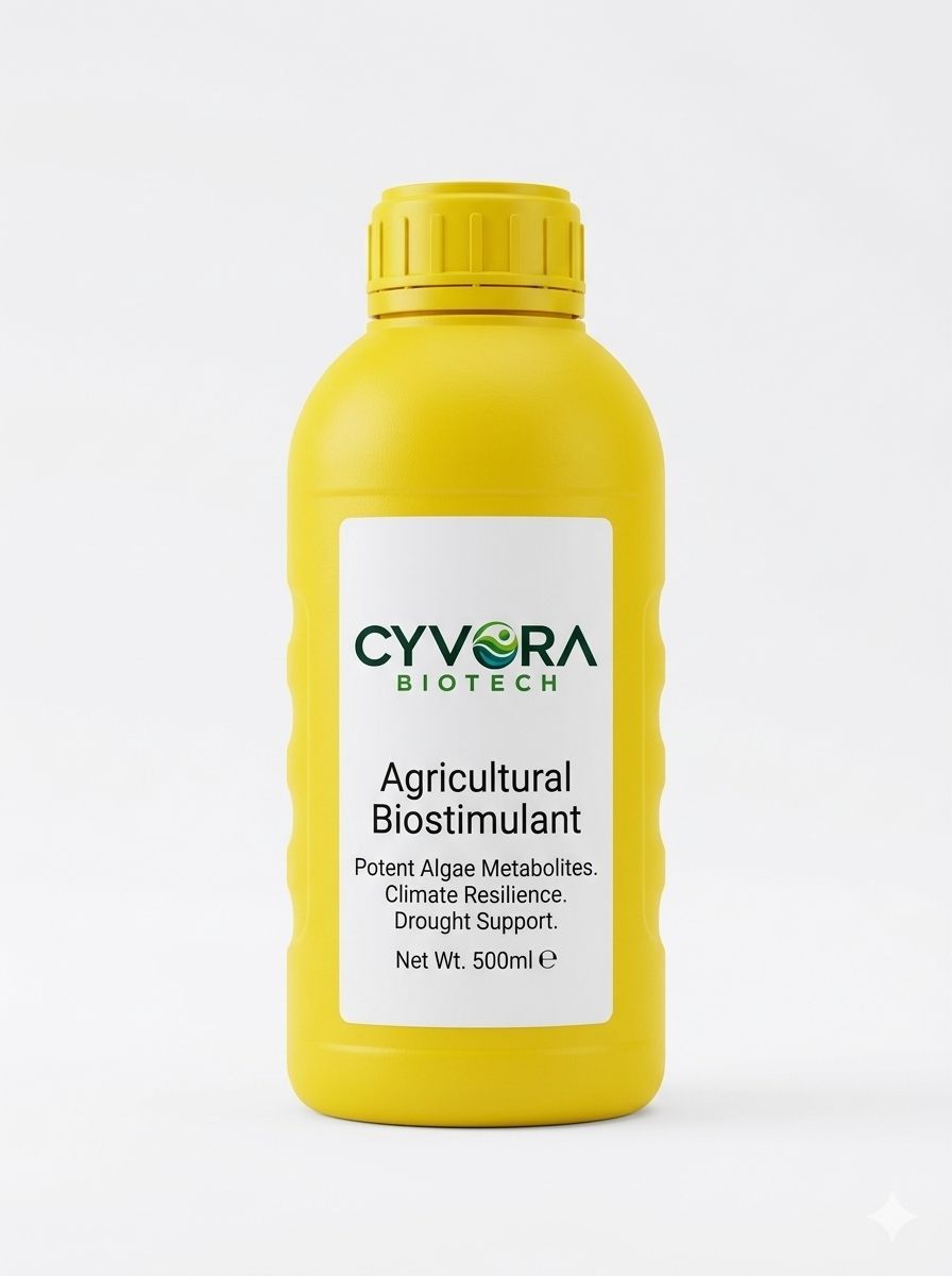 A 500 ml bottle of Cyvora agricultural biostimulant standing in a field of young green crops.
